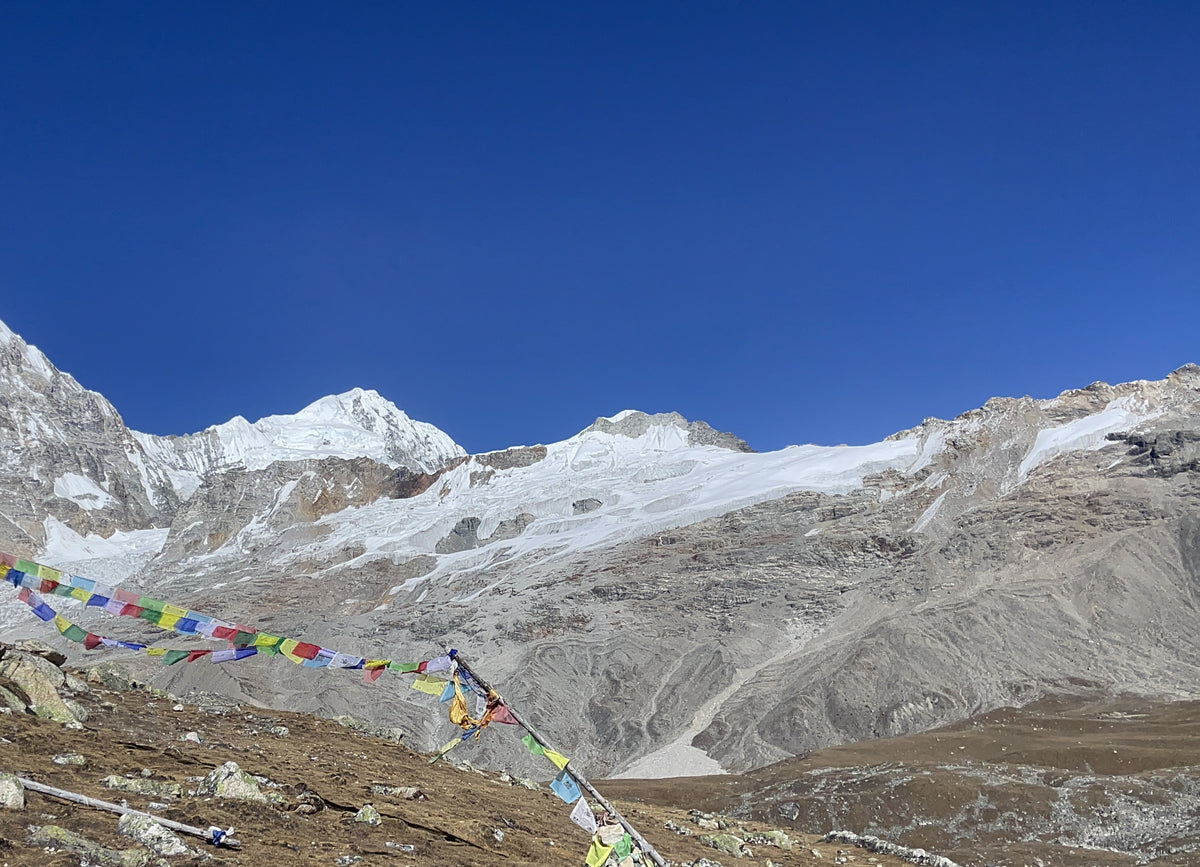 Prayer flags and glacier in Langtang, Nepal.