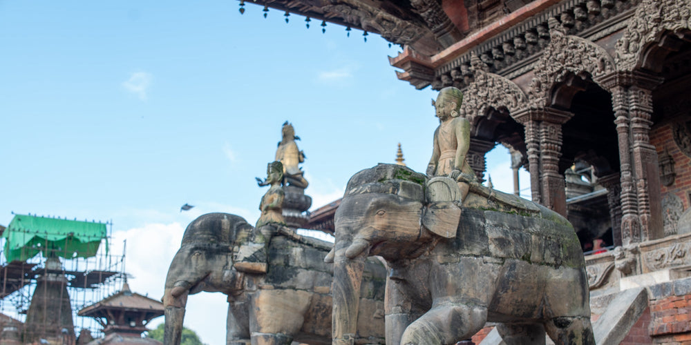 Stone elephant guardian statues beside a temple in Patan, Kathmandu Valley, Nepal.