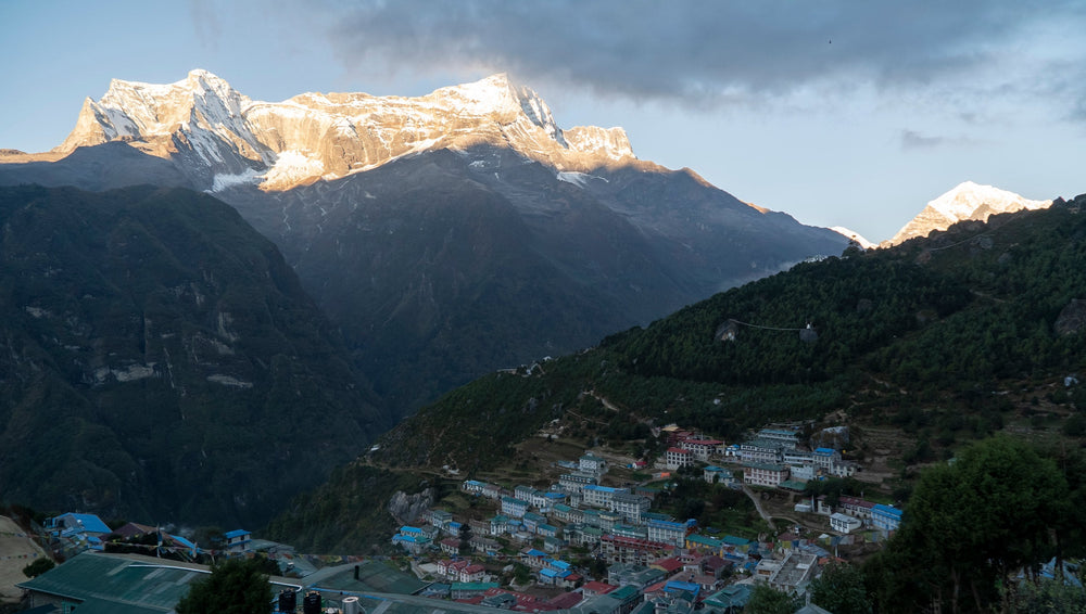 Namche Bazaar at dusk, with the last sun on the snow peaks across the valley, in the Khumbu, Nepal