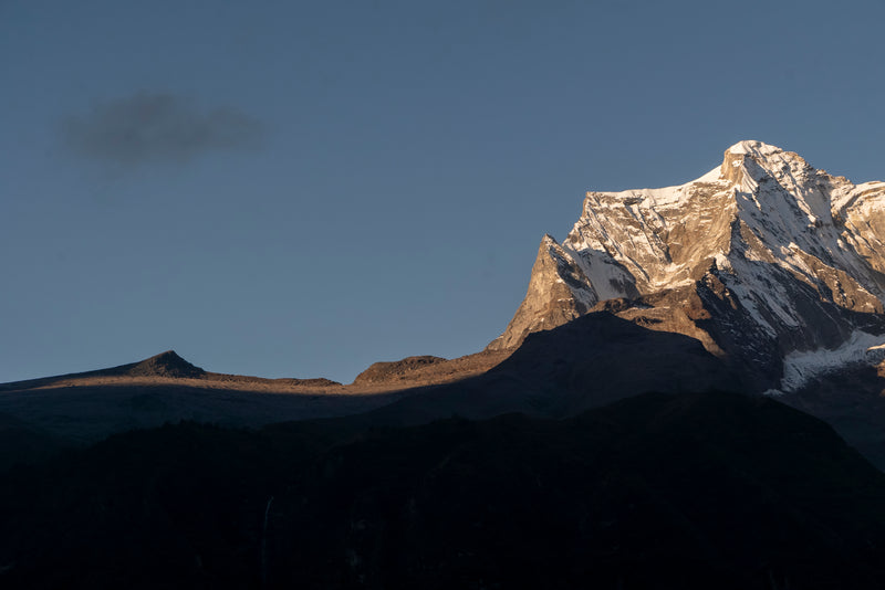 Snow-capped mountain peak against a clear blue sky