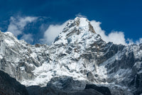 Snow-capped mountain peak with a clear blue sky