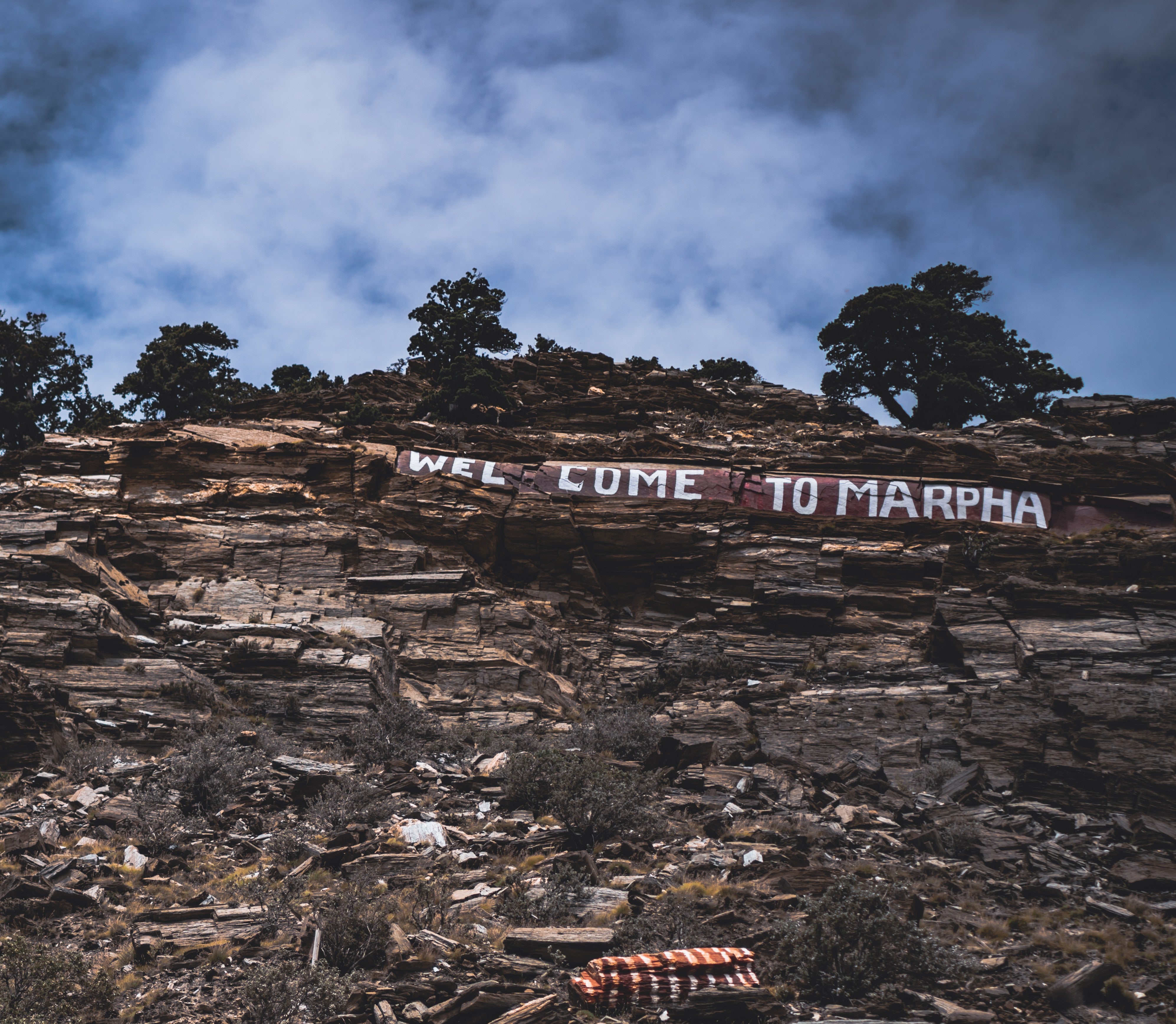Welcome sign on the cliff above Marpha village in the Kali Gandaki valley, Nepal