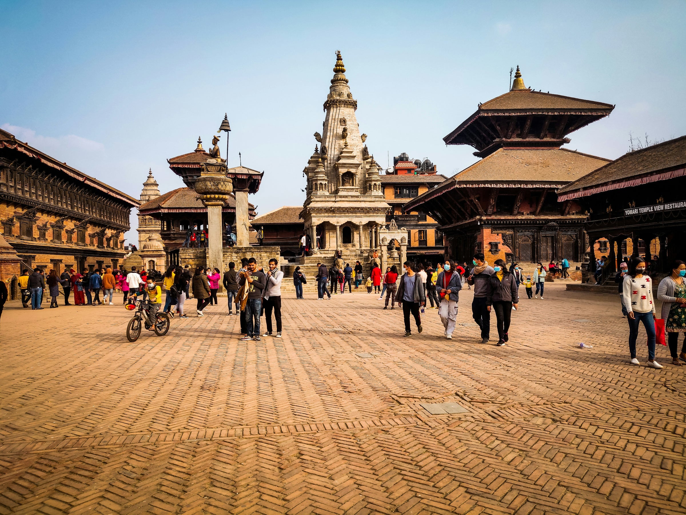 Square with traditional architecture and people walking around