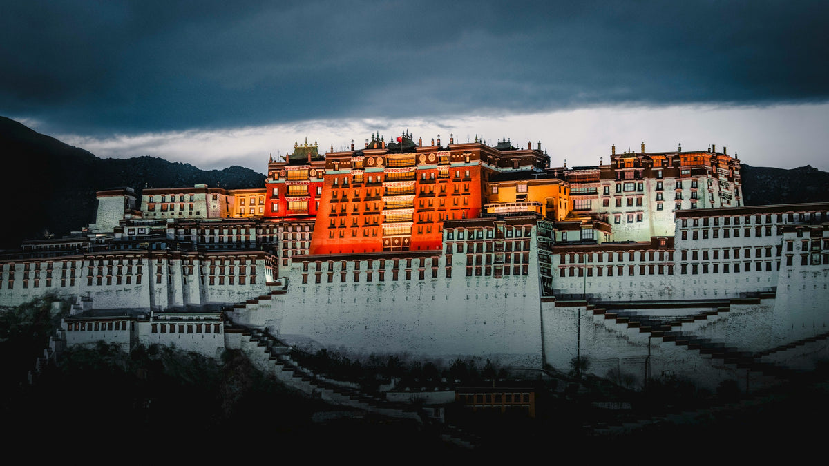 Stately building illuminated at night with a dark sky above