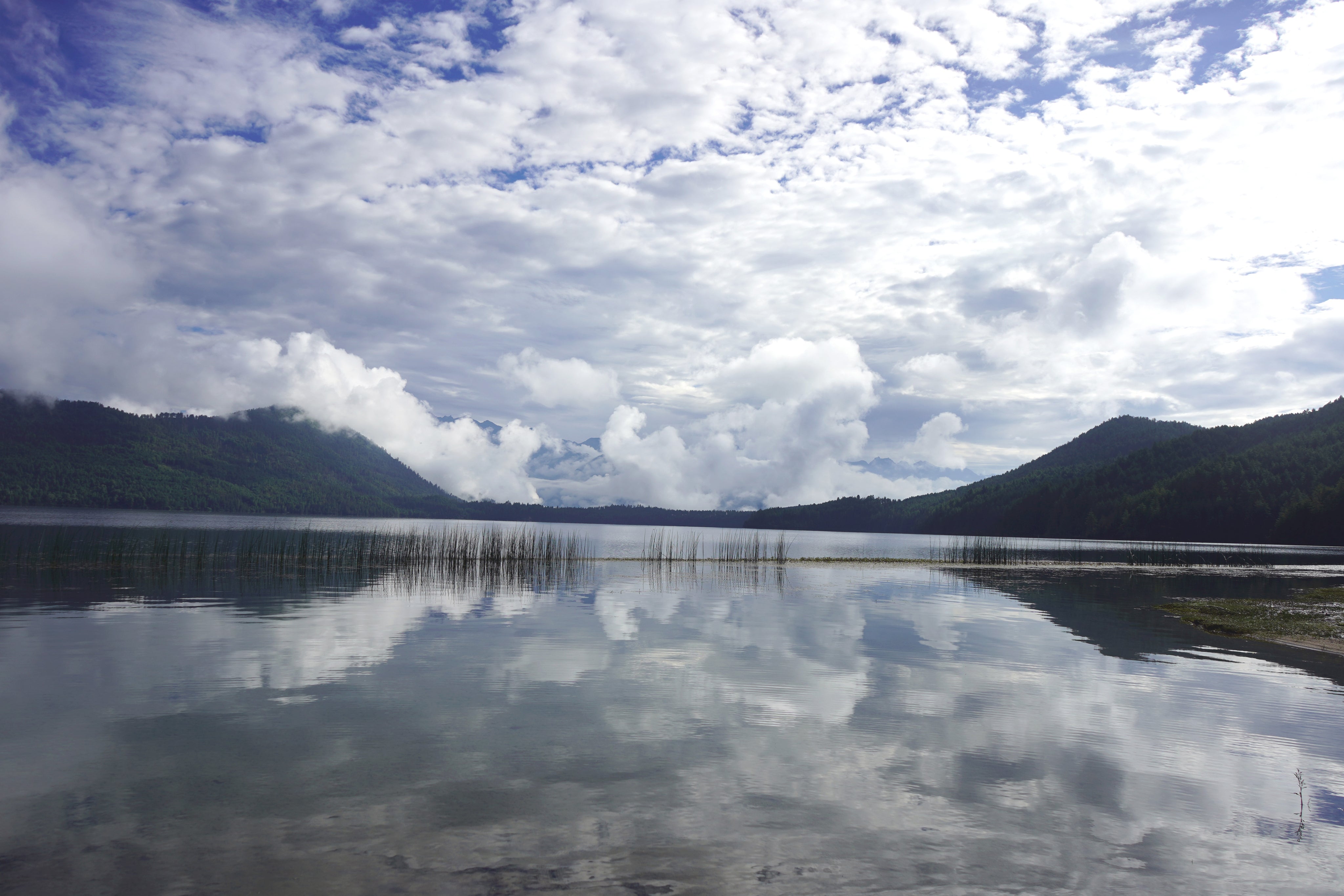 Hills reflected in Rara Lake, Nepal.