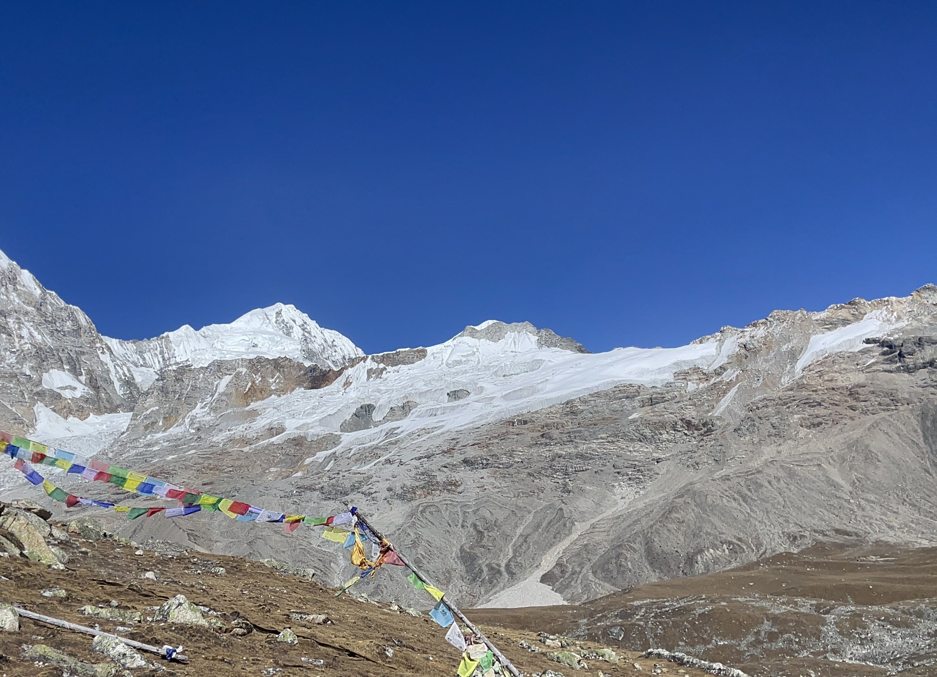 Prayer flags and glacier in Langtang, Nepal.