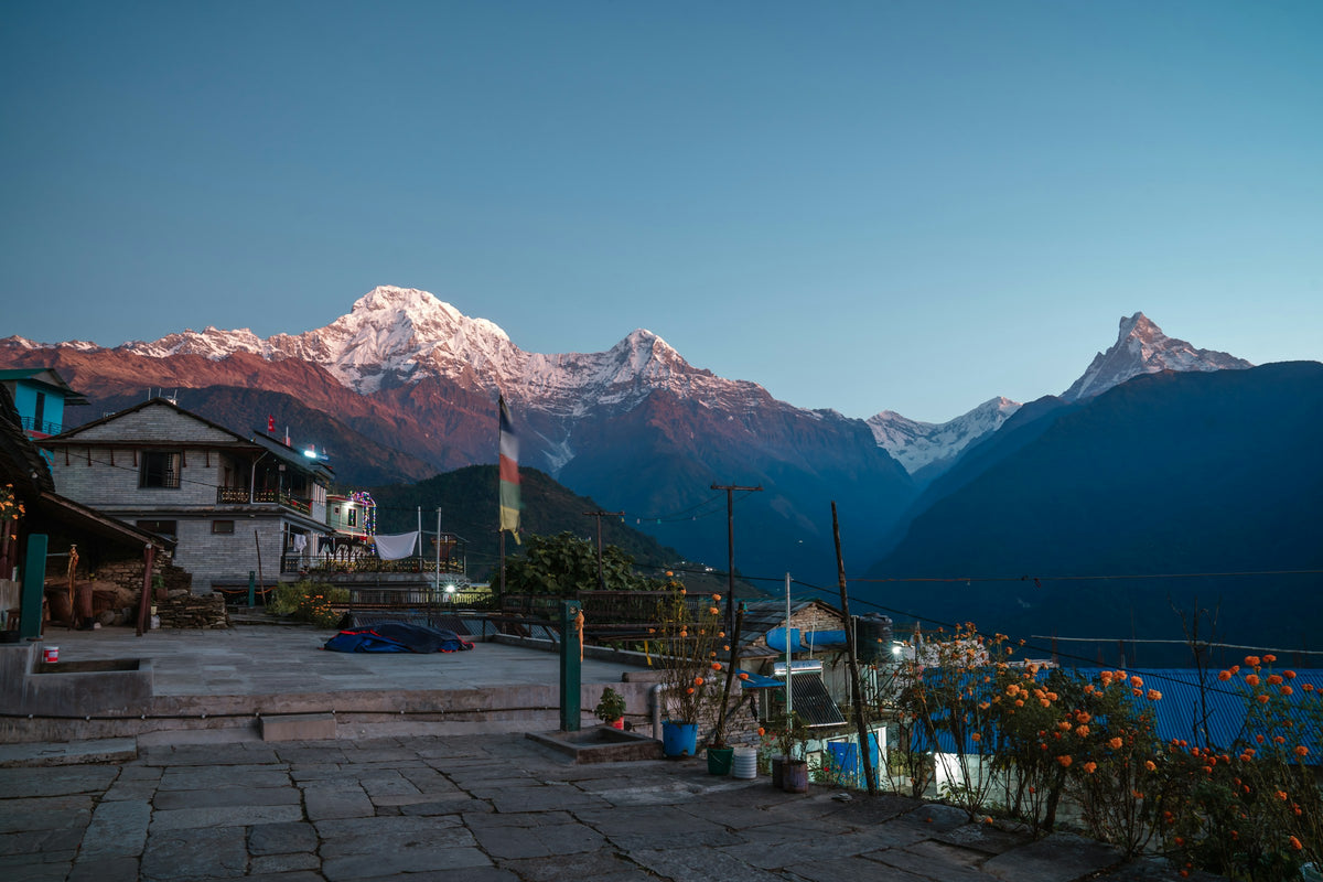 Small village with mountainous landscape at sunset